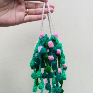 Crochet Hanging Plant Decor with green vines and pink flowers